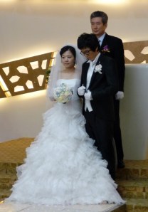 The bride, the groom, and the minister